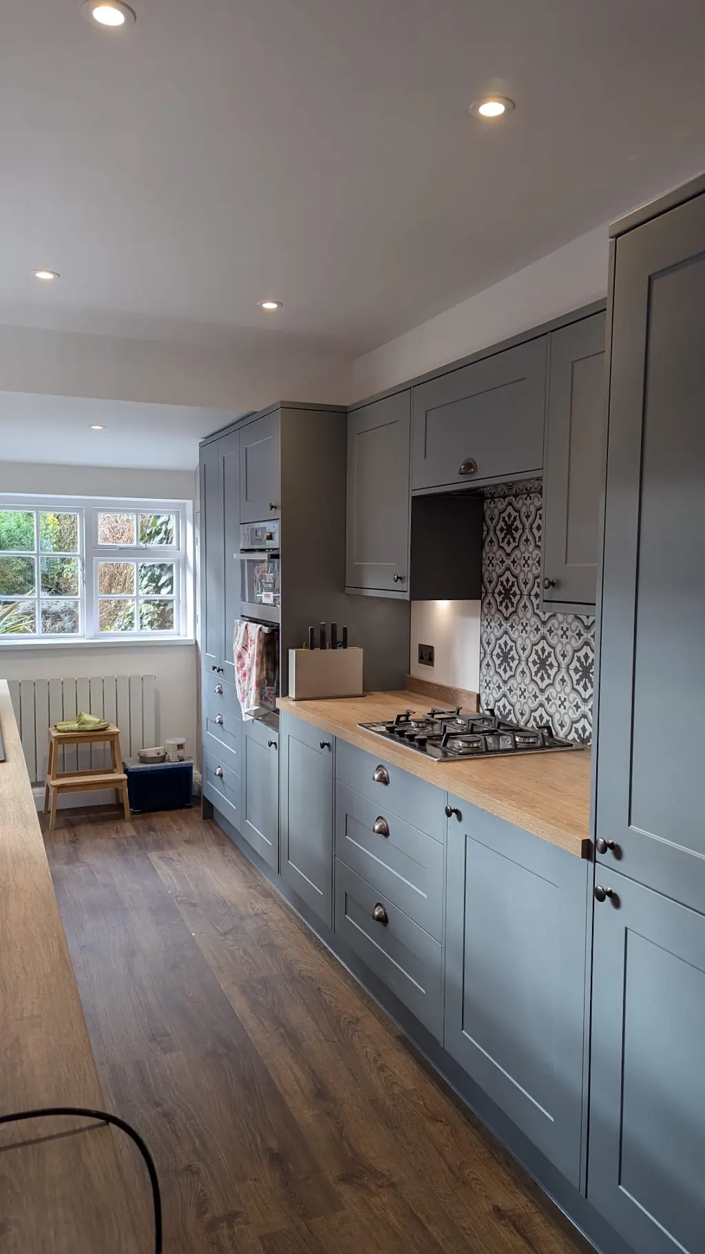 Blue-grey kitchen with oak worktop